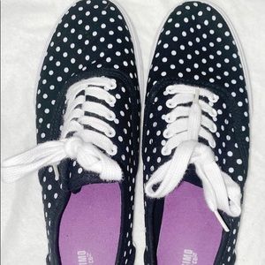 Black sneakers with white polkadots
